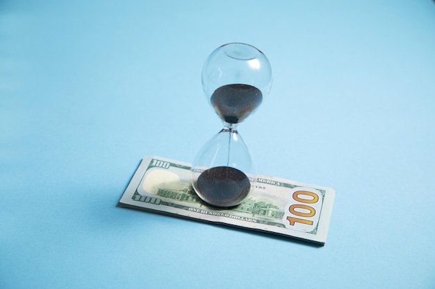 Hourglass with a dollar banknote Business