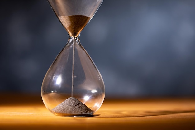 Hourglass on a wooden table