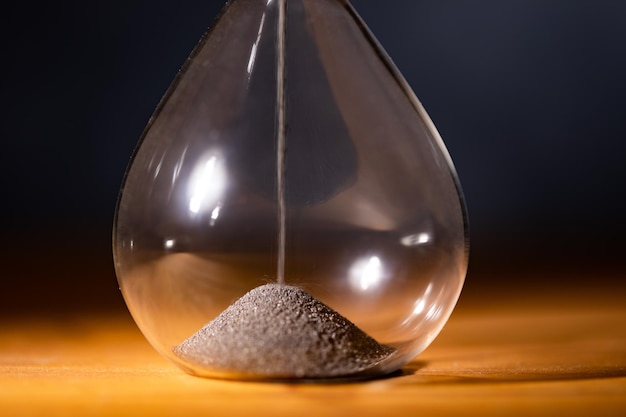 Hourglass on a wooden table