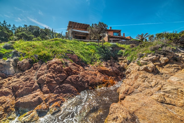 House by a rocky shore in Sardinia