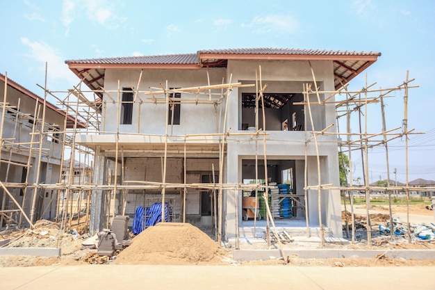 House under construction with autoclaved aerated concrete block structure at building site