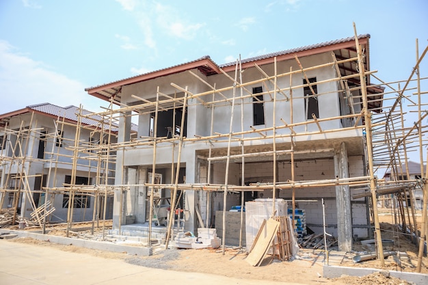 House under construction with autoclaved aerated concrete block structure at building site