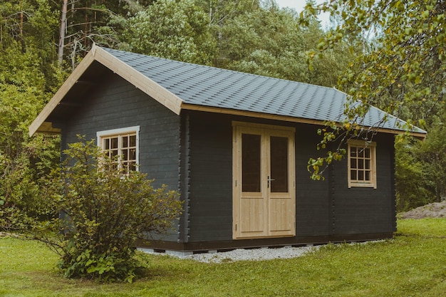 House in a field surrounded by trees in Latvia