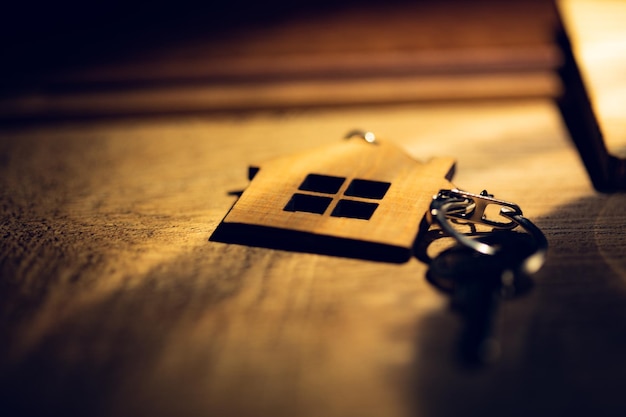 House model and house key on table