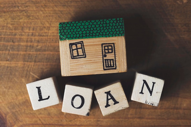 Photo house model with loan word made from wooden blocks home finance concept