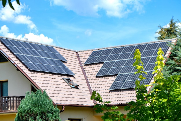 House roof with photovoltaic modules. Historic farm house with modern solar panels on roof and wall