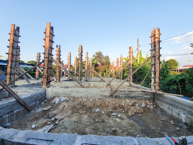 House structure construction Pour the cement floor and pour the cement pillars already. Background its sky.