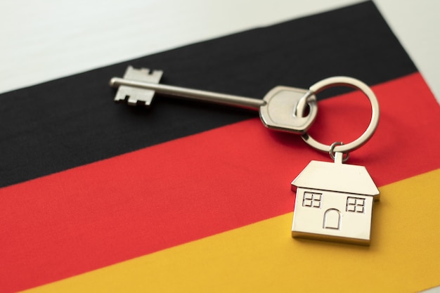 House with the flag of Germany Immigration Buying real estate Houses for rent Property price Acquisition of real estate in another state