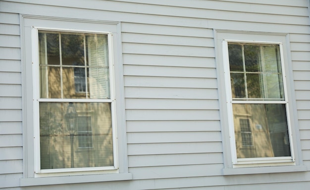 A house with a white siding that says'the word house'on it