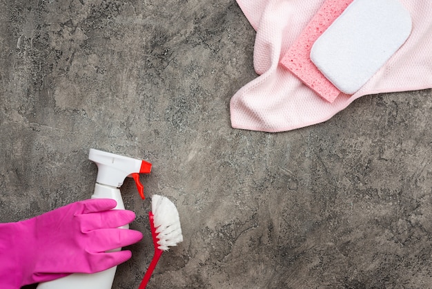 Household accessories lying on a background of gray decorative plaster.