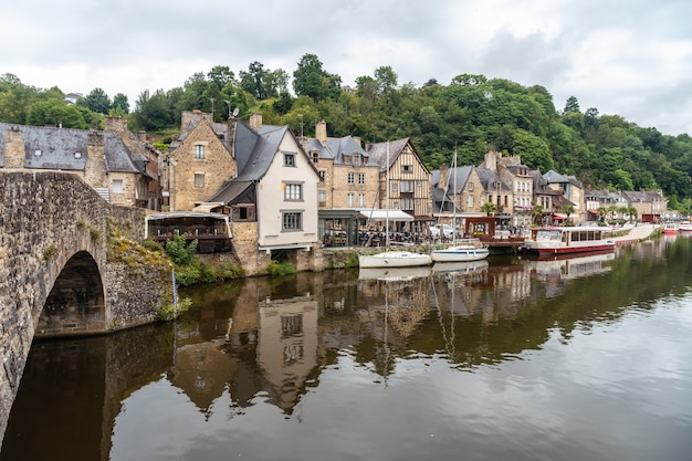 Houses and boats on the Rance river in Dinan medieval village in French Brittany, France