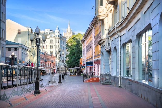 Houses and cafes and lanterns on the Arbat in Moscow on a summer morning