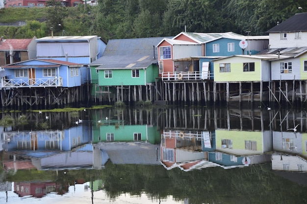 Houses on stilts palafitos reflected in the water in Castro Chiloe Island Patagonia Chile