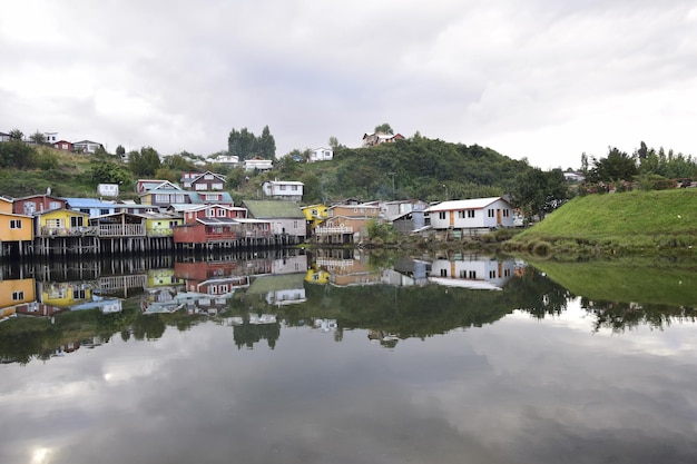 Houses on stilts palafitos reflected in the water in Castro Chiloe Island Patagonia Chile