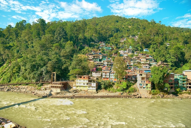 Houses in a town on river. India, Sikkim, Gangtok