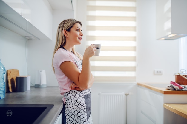 Housewife drinking coffee and taking a break.