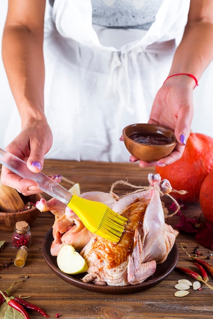 Housewife prepares roast chicken