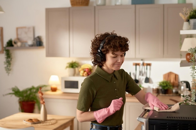 Housewife wiping dust in the kitchen