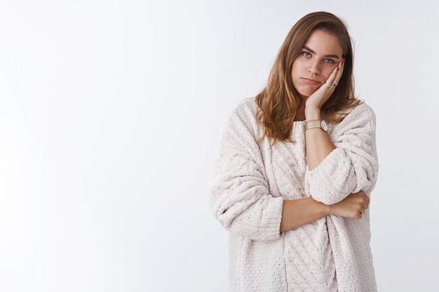 How boring. Portrait of sleepy tired annoyed woman listening boring uninteresting lecture forced hear parents scolding facepalming leaning face bored, standing indifferent careless white background