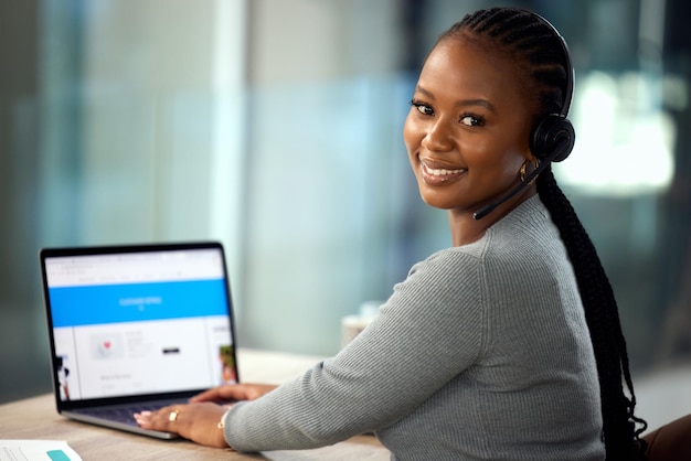 How can I assist. Cropped portrait of an attractive young female call center agent working in her office.