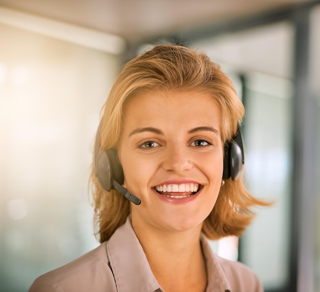 How can I help you Cropped portrait of an attractive young woman working in a call center