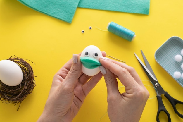 How to make felt bunny for Easter decor and fun.  DIY concept. Step by step  instruction. Step 8. We apply the mask to the egg.