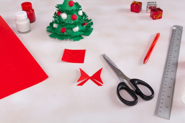 Photo how to make nice christmas tree from color paper with children step by step diy 
project step 12