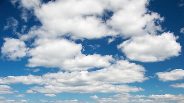 Huge blue sky with white clouds. Nature background. Can be used for underlay.