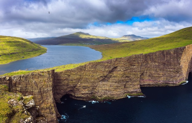 Huge cliff and lake Sorvagsvatn on island of Vagar Faroe Islands Denmark