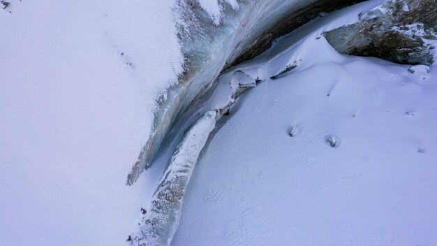 A huge ice wall from a glacier in the mountains