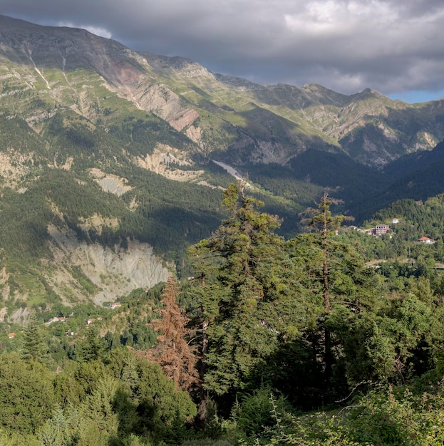 A huge majestic mountains from high in the summer on a cloudy day region Tzoumerka Epirus Greece