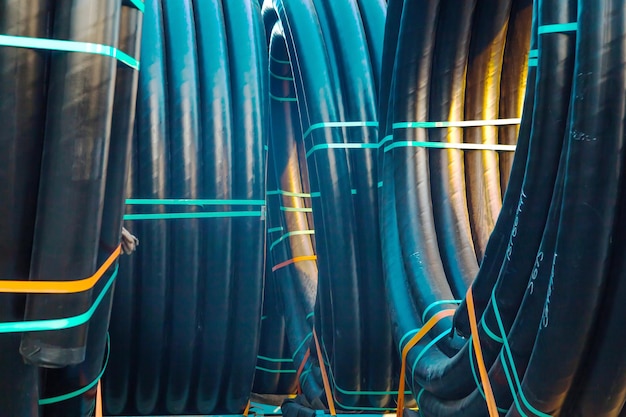 Huge new electrical cables tied into spools closeup