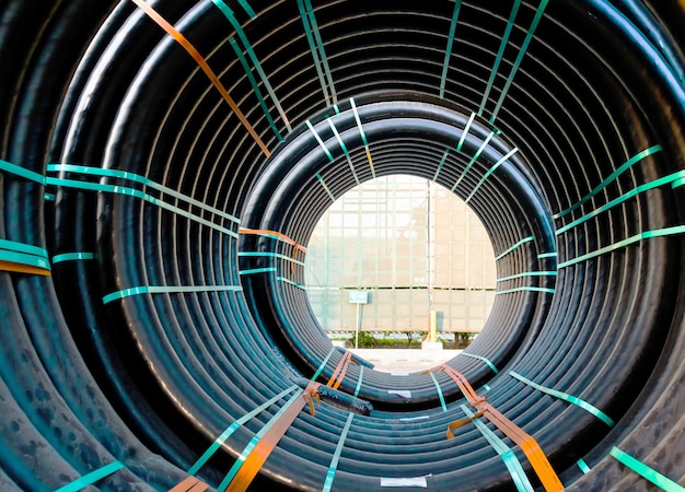 Huge new electrical cables tied into spools closeup