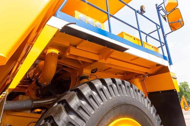 Huge rear wheels of dump truck at unusual angle closeup