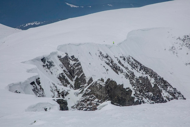 Huge rocks Shpytsi covered with white snow Carpathian Mountains