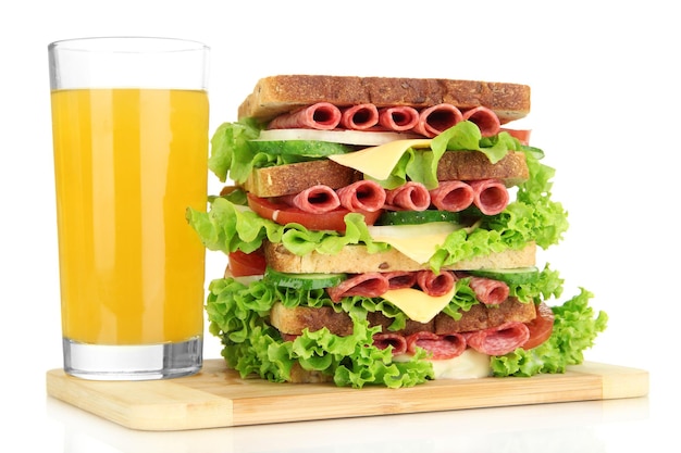 Huge sandwich on wooden board isolated on white