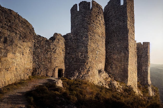 Huge stone castle with medieval door in suns rays