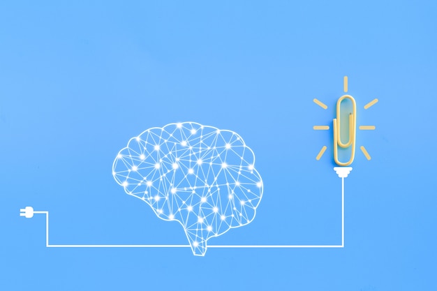 human brain and paperclip connected together