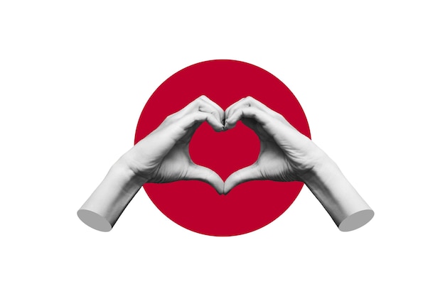 Human female hands showing a heart shape isolated on a background of the flag of Japan