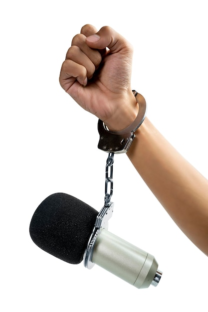 A human hand in a handcuff with a microphone