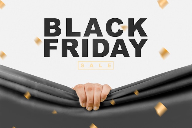 Human hand opening black curtain with Black Friday sale text