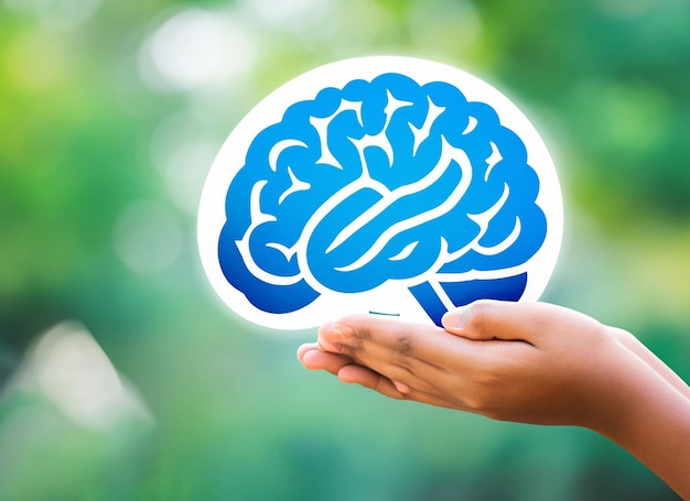 Human hands holding brain of earth over blurred blue nature background mental health day concept