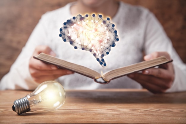 Human showing book with a human brain Knowledge Education