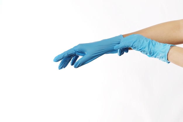 Human wearing glove on white background.