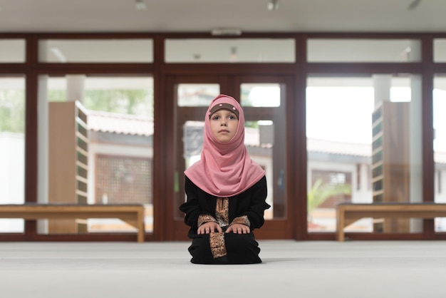 Humble Muslim Child Is Praying In The Mosque