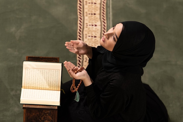 Humble Muslim Woman is Praying in the Mosque