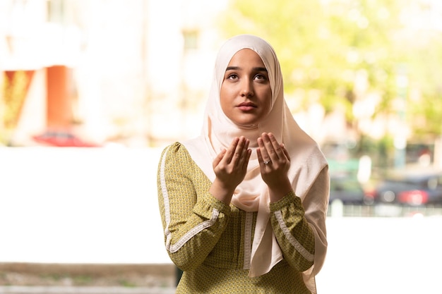 Humble Muslim Woman is Praying in the Mosque