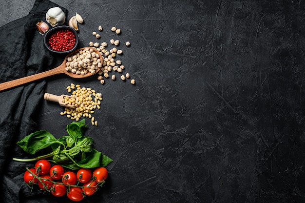 Hummus ingredients, garlic, chickpeas, pine nuts, Basil, pepper. Top view. Copyspace background