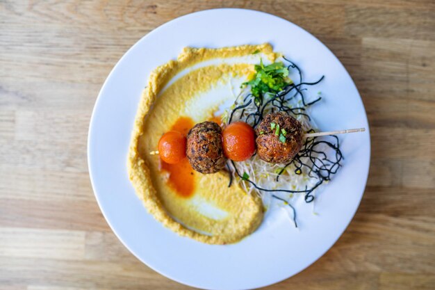 hummus and meatballs on the plate