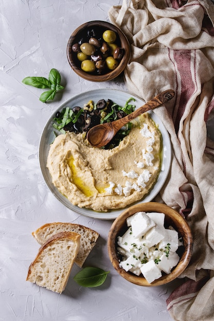 Hummus with olives and herbs